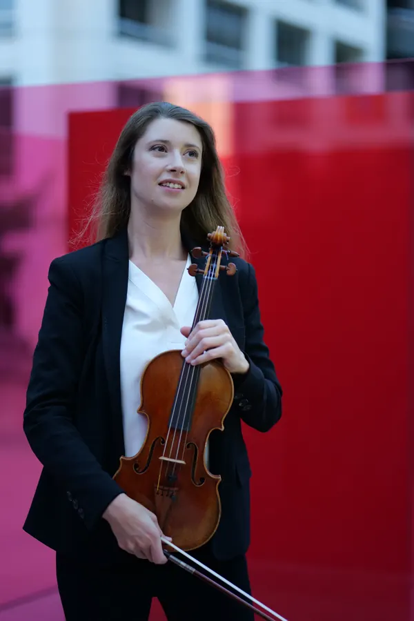 With violin and bow, black blazer and white blouse — photo by Cicely Parnas
